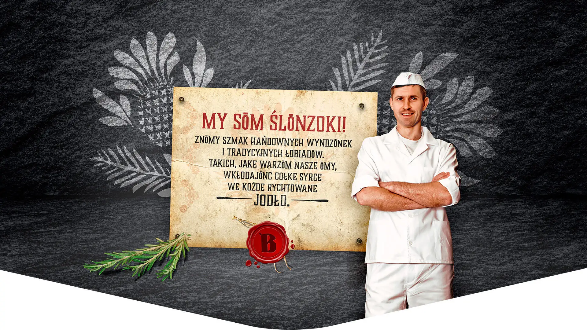 Rzemieślnik Berger przy tablicy z hasłem My sōm Ślōnzoki